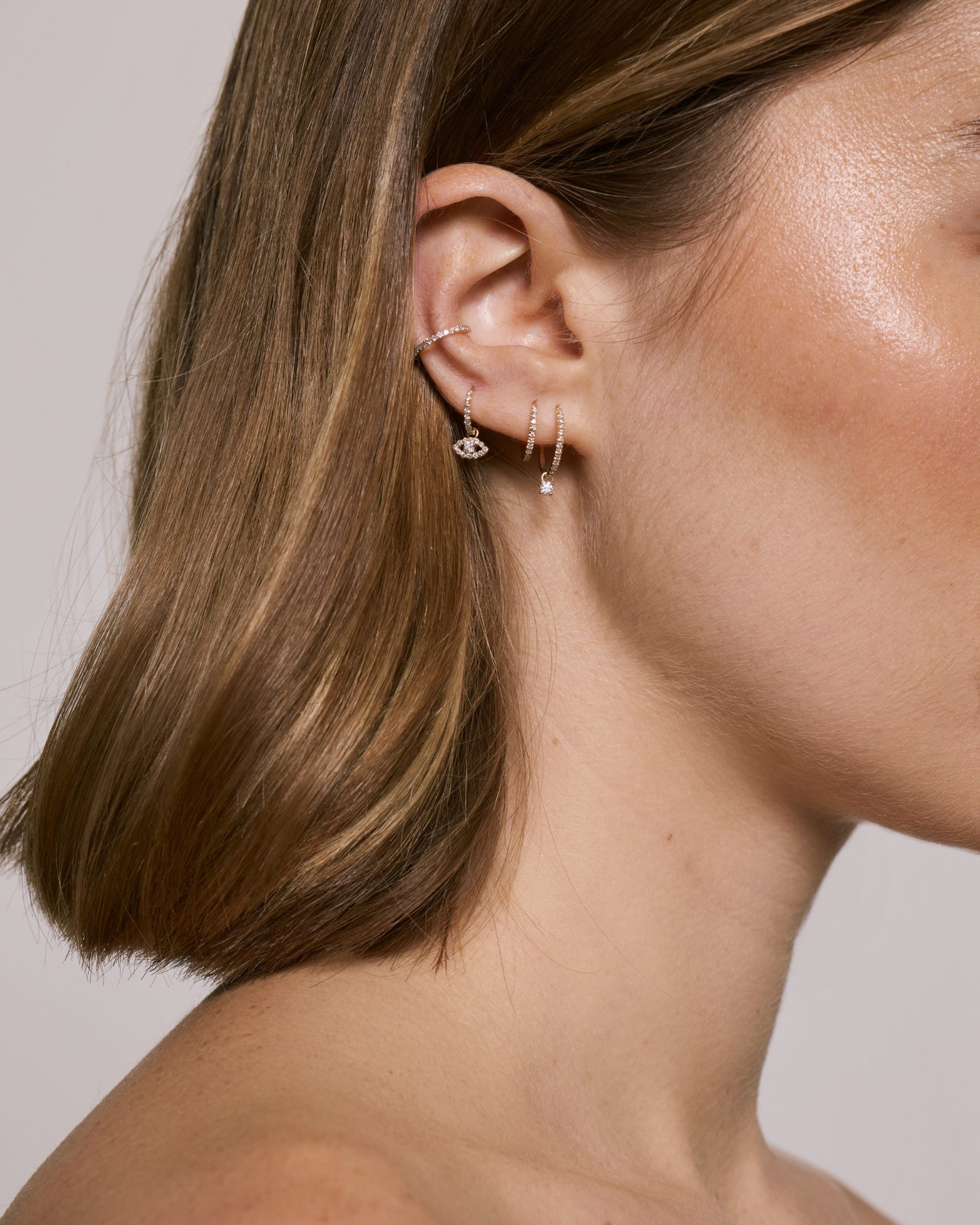 Composition charm œil diamant en or massif 375 jaune avec créole